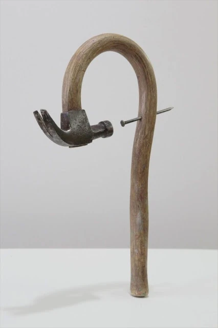 Hammer and nails sculpture | Characteristics of modern art nailed