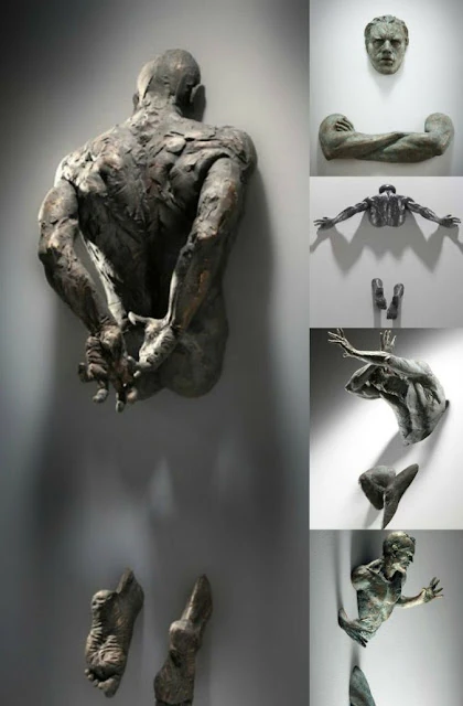 Man in wall sculpture | Modern art characteristics