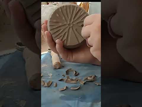 Adding texture to pottery- carving