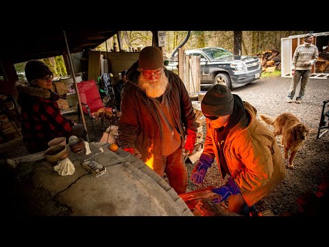 Ceramics class fires pots in the woods in an anagama kiln