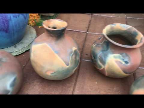 Pit firing students pottery